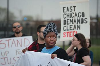 Environmental activists protest outside a Chicago elementary school closed in 2016 after high levels of lead and arsenic were fo