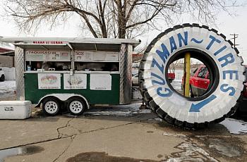 A loncheria cart in the parking lot of a tire store in Globeville. Credit: Stephen Swofford