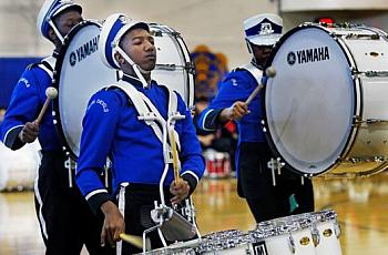 Maleak Taylor (left), a freshman at North Divison High School, plays quints for the drumline during the MPS Hosts City Drumlime 