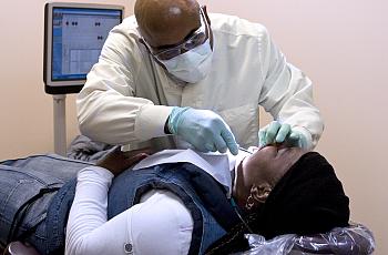 D.C. dentist Albert Cheek prides himself on his skill with extractions.