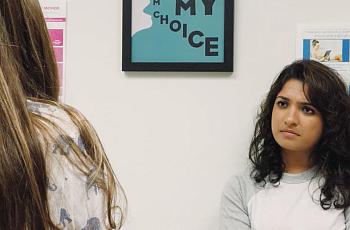 Reporter Neha Shastry sits with patient waiting to speak with the abortion provider at Trust Women Oklahoma City.