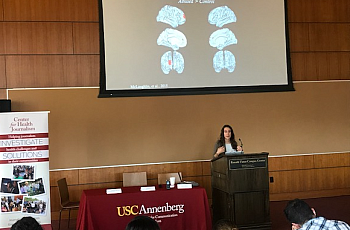 Katie McLaughlin, director of the Stress and Development Lab at the University of Washington, speaks to a room full of reporters. Katie McLaughlin, director of the Stress and Development Lab at the University of Washington, speaks to fellows at the 2017 Nati