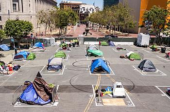 Rectangles painted on the ground to encourage homeless people socially distance at a city-sanctioned homeless encampment 