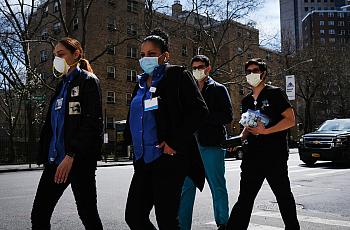 Medical workers outside of Mount Sinai Hospital in New York City. GETTY IMAGES