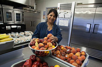 Reporter Leilani Clark's story featured Hortencia Garcia, food service manager at Roseland Elementary, who prepares fresh produce for students. (Photo by Michael Amsler/North Bay Bohemian)