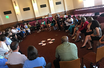 Fellows participate in group discussion in a circle