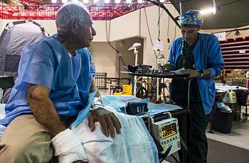 A local resident from Humacao, Puerto Rico, is prepared for hand surgery.