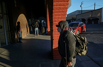 People walk into downtown Calexico after crossing the United States-Mexico border on December 1, 2020. 