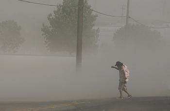 Photo credit: Craig Kohlruss/Fresno Bee: Dust storms like this one that blasted Fresno in June can carry millions of spores fromthe fungus that causes Valley Fever.