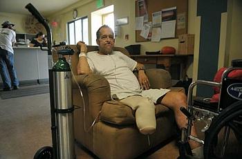 William "Kickstand" Armstrong sits in a chair at Casa Esperanza, where he is recovering from pacemaker surgery and a three week 
