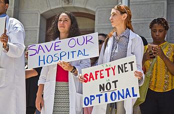 Employees, city officials, and unions rallied against the closing of Hahnemann hospital in Philadelphia in 2019. 