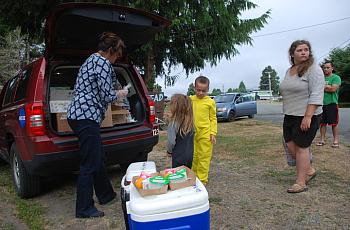 Deborah Kravitz gives breakfast to 6-year-old Mateo Rodriguez and his 4-year-old sister AnnaLee in Klamath Glen.