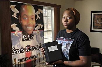 Sunsearae 'Lo Lo' Hall, mother of Kenis Green Jr., holds her son's ashes. Kenis was 12 when he was shot and killed on his front porch. Max Ortiz / The Detroit News  