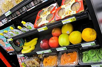 The healthy checkout aisle at the Parkersburg Foodland includes whole and sliced fruit.