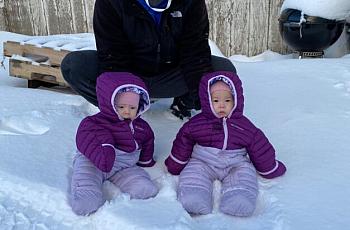 Twins Anna and Mila with their father, John Melovidov, in St. Paul. 