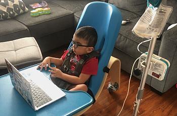 Gavin Alcala, 3, of Los Angeles participates in an online class through his day care, Centro de Niños