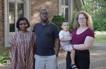 Paul Gakpo (second from the left) lives in Kentucky with his wife, Michelle (far right) and son, Louis. The family poses for a p