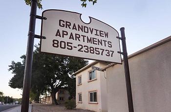 The sign that used to mark the entrance to Grand View Apartments, where hundreds of renters lived with poor conditions for years
