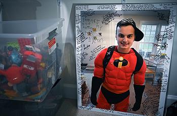 A photo of Zachary Chafos dressed as one of his favorite Pixar characters, Mr. Incredible, at his home in Clarksville, Md