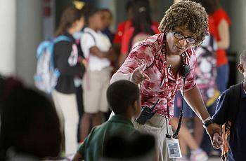 Lakewood Elementary principal Cynthia Kidd talks with students. [Photographs by Tampa Bay Times/Dirk Shadd.] 