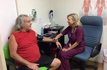 Kim Harden takes a patient's blood pressure at the Lake Wales Free Clinic. Julio Ochoa/WUSF