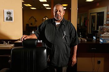 Walter Shearin talks with his customers about prostate cancer at his store, Walt's Diversity Barber Shop, in Roanoke Rapids.