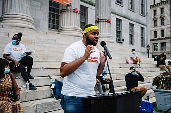 Larry Malcolm Smith Jr. spoke about his experience in the foster care system at a march for Black foster youth.