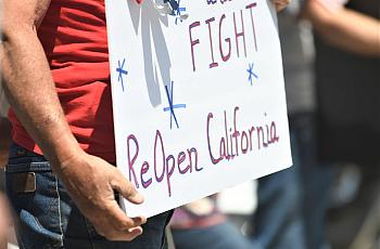Nearly 300 people rallied at the corner of Mooney Boulevard and Caldwell Avenue urging Gov. Gavin Newsom to reopen the state.