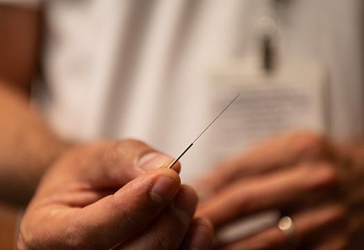 A hand with a needle