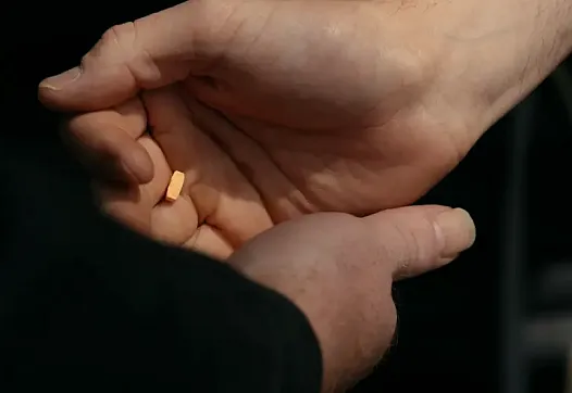 handing pills