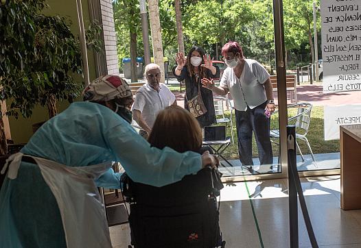 Medical worker comforting a patient at the nursing home