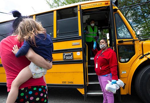 Mom dropping off child at the school bus