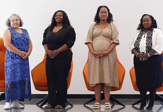 Four women standing 