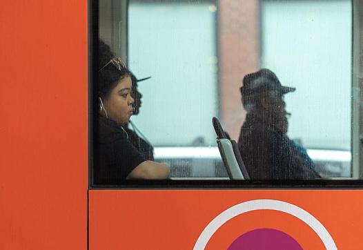 People sitting in a bus photo from window.