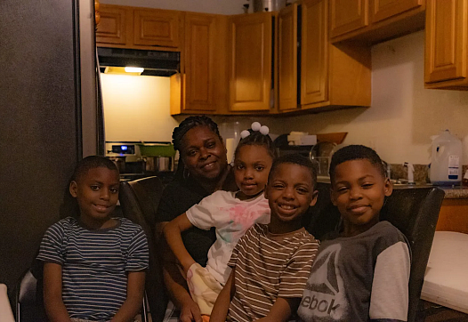 Person surrounded by children