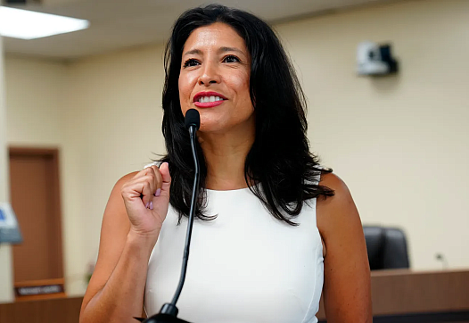 Person speaking into a mic