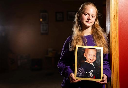 A person holding a photo frame