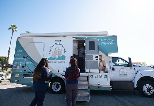 Folks wait to enter Clinica Sierra Vista's Mobile Clinic
