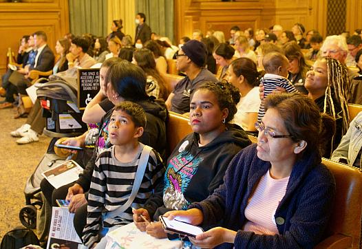 People sitting in a large room