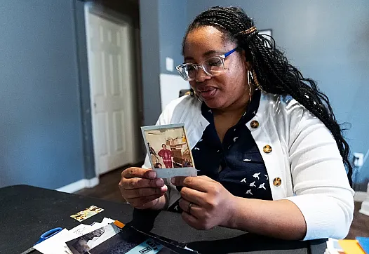 Person looking at a photograph