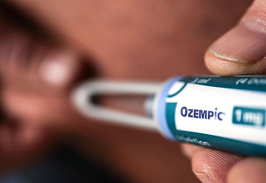 Ozempic shown being administered.