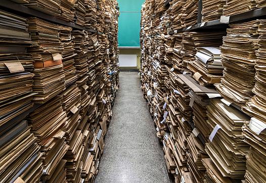 Archival files shown in a room.