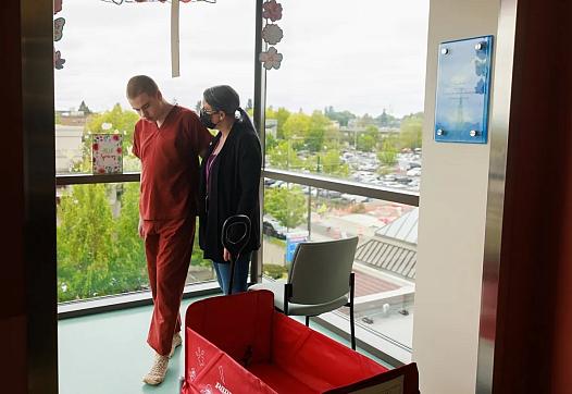 Greta Johnson with her son Jack Hays, at Mary Bridge Children’s Hospital, where he has spent more than a year. Jack’s story was central to reporter Hannah Furfaro’s Seattle Times series on the youth psychiatric boarding crisis.