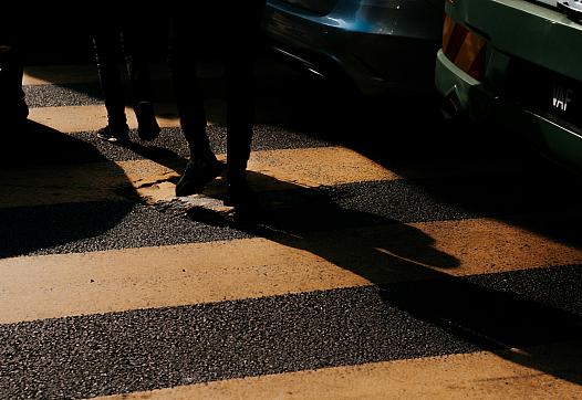 Person walking in dark alley