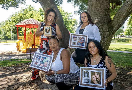 4 people holding photo frames