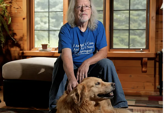 Person seated with a dog