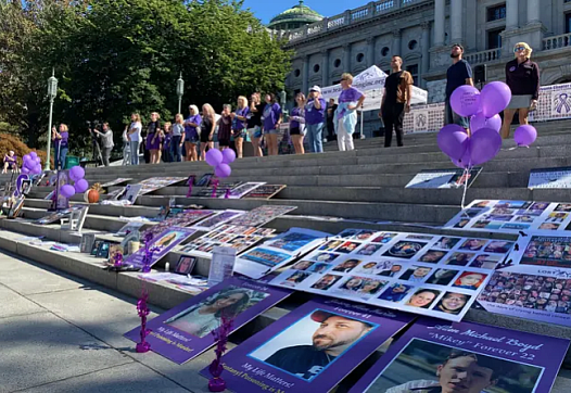 Posters and balloons laid out on steps