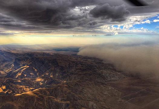 A dust storm spreads through the Central Valley.