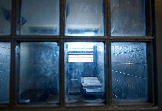 A dark room seen through a window