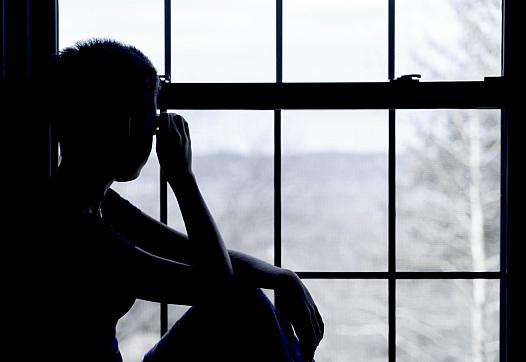A person sitting by the window 